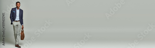 Striking presence of a stylish young man in modern attire exuding confidence and charm