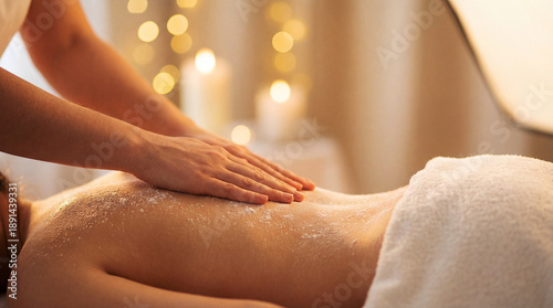 Wallpaper Mural Woman receiving a relaxing spa treatment with salt scrub on her back in a serene environment Torontodigital.ca
