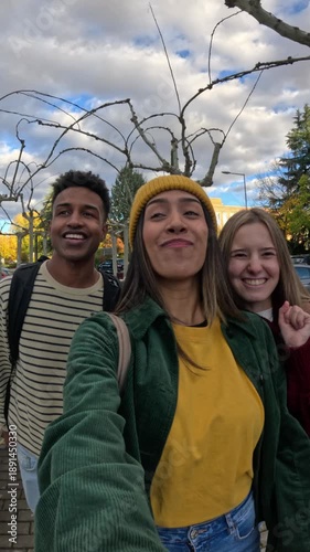 Diverse friends taking selfie video outdoors