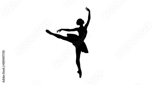 Silhouette of a graceful ballerina performing a ballet pose.
