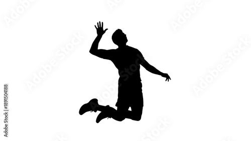 Silhouette of a male volleyball player jumping to hit the ball.