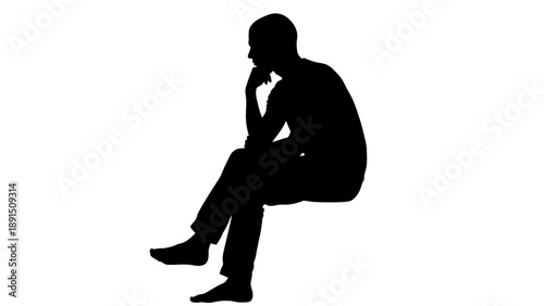 Silhouette of a man sitting and thinking with hand on chin.