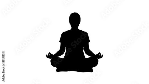 Silhouette of a person meditating in a lotus pose.