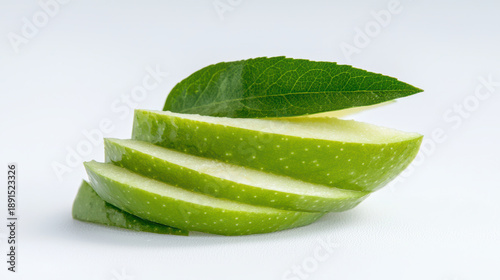 Fresh sliced green apple with leaf, showcasing vibrant color and texture, perfect for healthy snacks or culinary presentations