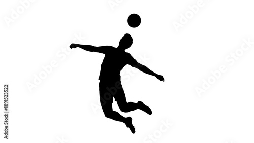 Silhouette of a soccer player heading the ball in mid-air.