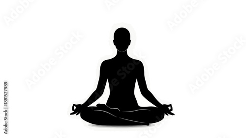 Silhouette of a person in lotus position meditating.