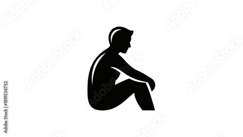 Silhouette of a Seated Person in a Contemplative Pose.