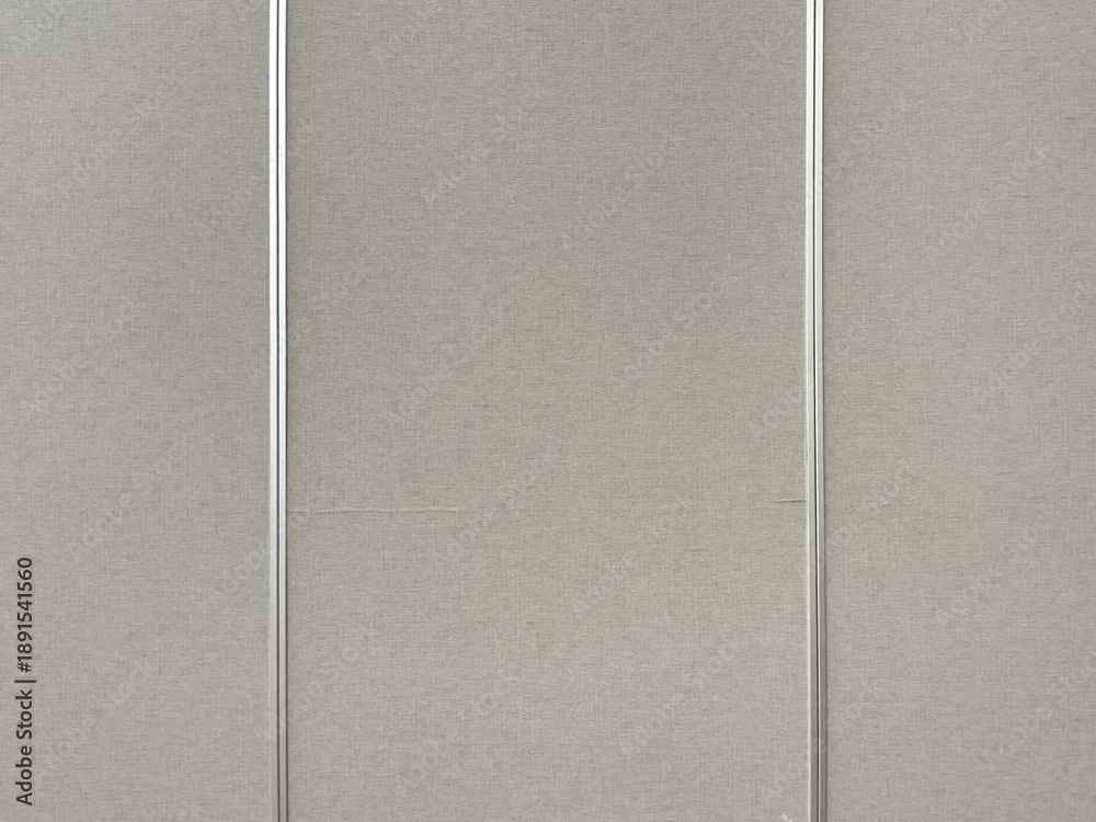 Fototapeta premium Close up of grey linen wallpaper with stainless aluminium frame and strips. Suitable for wall panel design. Seamless background texture.