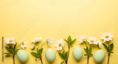 Easter eggs and flowers on a yellow background