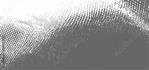 Grey and white halftone dot pattern with scattered speckles fading from dense to sparse dots