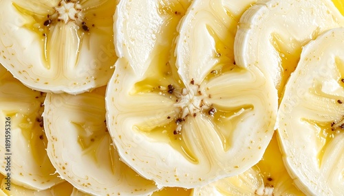 Close up of sliced ripe banana revealing its star-shaped core and seeds.