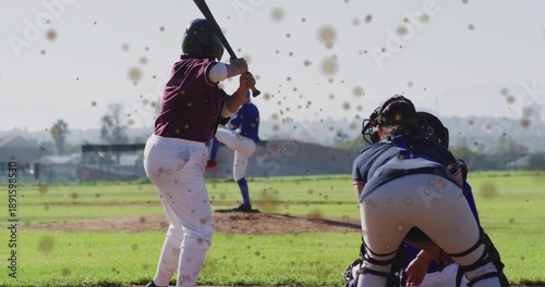 Obraz na plátně Holding bat, female batter in maroon jersey preparing swing at home plate, with