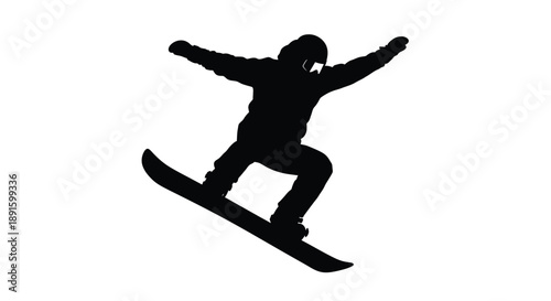 A silhouetted snowboarder mid air performing a trick on a snowy slope