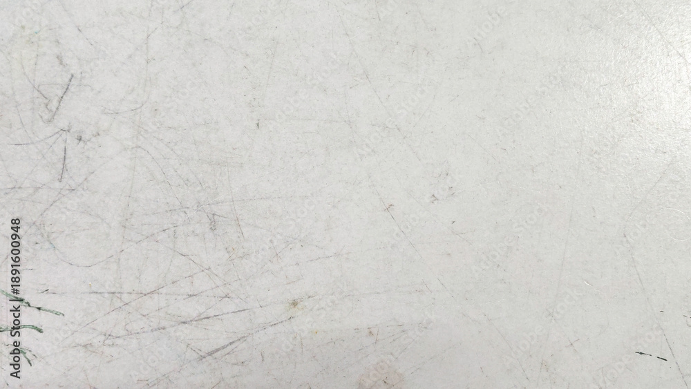 Fototapeta premium Close-Up of Scratched Kids Table Surface Showing Signs of Frequent Use and Play