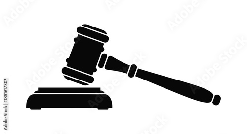 A stark black silhouette of a traditional gavel resting on a sound block representing justice and legal proceedings silhouette