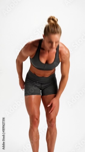 Muscular Woman Experiencing Pain in Shoulder and Knee During Workout