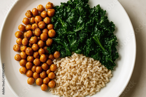 Roasted chickpea, cooked kale, and brown rice create healthy daily ritual meal in blue zones known for longevity and wellness