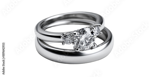 Two matching bands, one with a large center diamond and smaller side stones, elegantly stacked