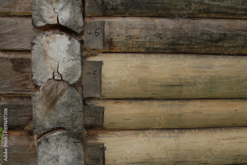 beautiful natural wooden logs stacked in a row	
