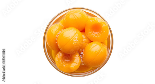 Sweet delicious peeled peaches halves in syrup in a glass bowl ready to eat, isolated on white or transparent background. PNG