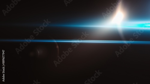 Photos Abstract light streaks and lens flare against dark background