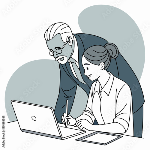 Experienced mentor guiding a young professional with work-related tasks at the office