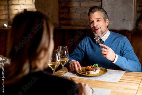 Man enjoys dinner with woma...