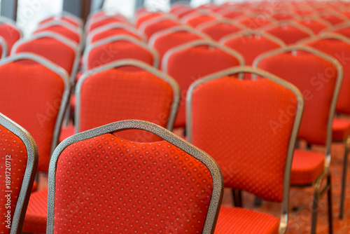 Bilde på lerret Conference hall seating with empty red chairs