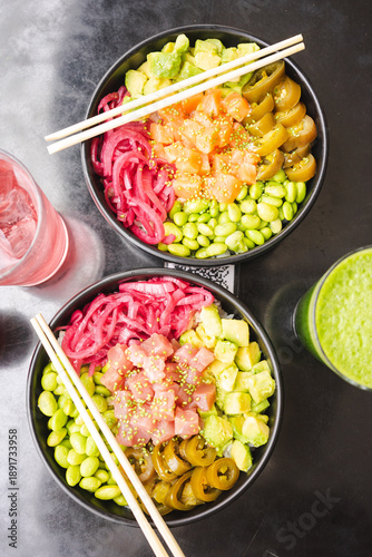 Healthy poke bowl with salmon served with drink