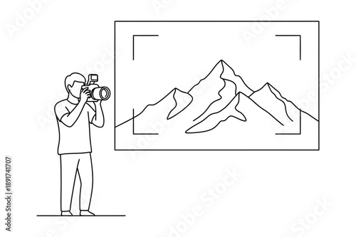 Photographer taking picture of mountain landscape with camera