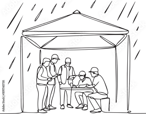 Group of people gathered under a tent during rain, discussing and working together
