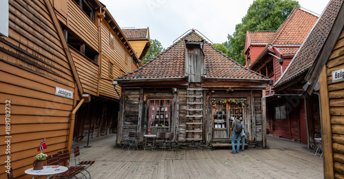 Narrow alley with old trading houses in the former commercial district Bryggen in Bergen