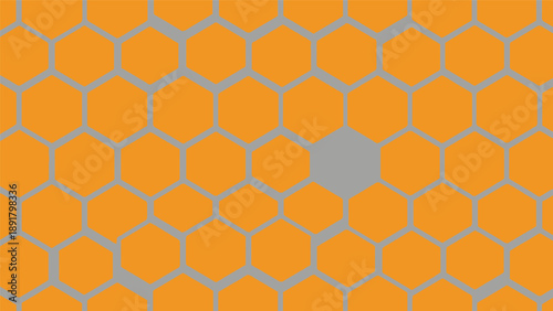 A gray hexagon stands out in an orange honeycomb pattern.