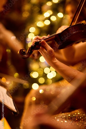 Female Hand Playing Strings on a Violin