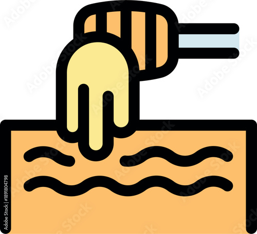 Honey dripping from wooden honey dipper onto a slice of toast for breakfast