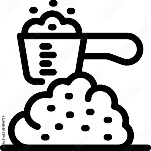 Measuring scoop pouring detergent or washing powder into pile of laundry, laundry cleaning concept