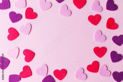 Happy Valentine's day! Stylish pink and red hearts flat lay on pink paper background. Modern cute love banner. Valentine card with space for text