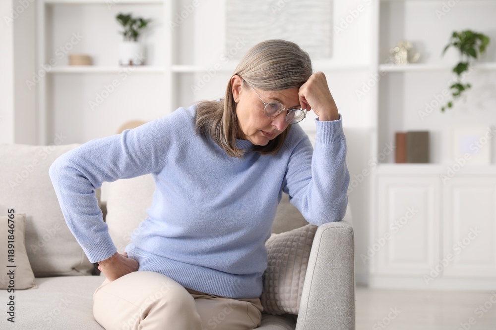 Fototapeta premium Amnesia. Senior woman trying to remember something at home