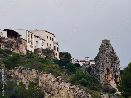 Photos Distant community located along rugged cliffs featuring ageold buildings and pea