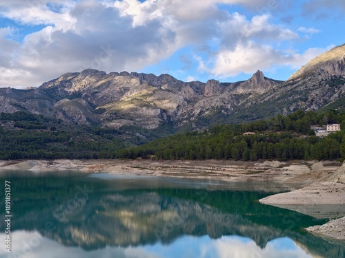 Peaceful home on tranquil waters, Quiet countryside dwelling nestled near shimmering emerald lake