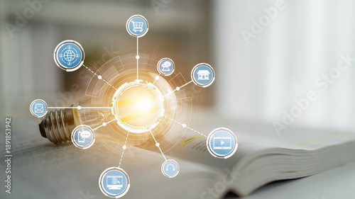 Εκτύπωση καμβά This image represents the concept of digital transformation, showcasing a light bulb symbolizing ideas surrounded by various technology icons, set against a book background