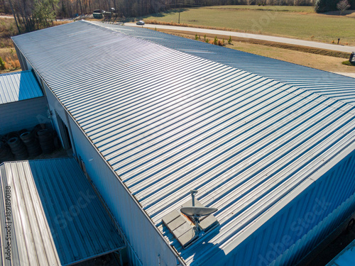 High Resolution Aerial Drone View of Gray Standing Seam Metal Roof On Commercial Building