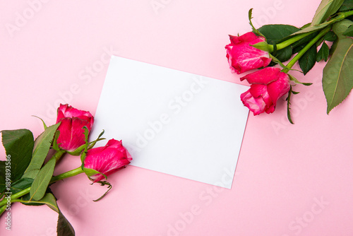 Beautiful and festive celebration background with roses, present and card for valentines day celebration or birthday wishes romantic in red and pink