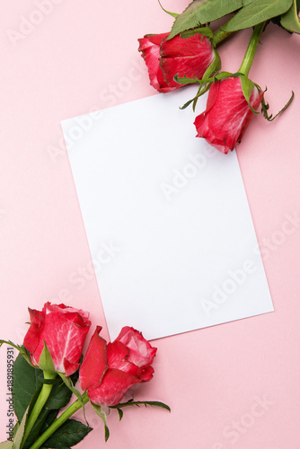 Beautiful and festive celebration background with roses, present and card for valentines day celebration or birthday wishes romantic in red and pink