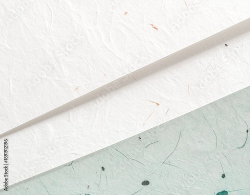Minimalist Japanese washi paper texture with organic fibers and soft shadows