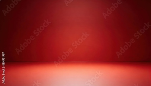 Empty red studio background with soft light and reflection on the floor