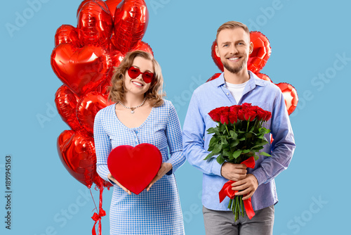 Young couple with gifts and...