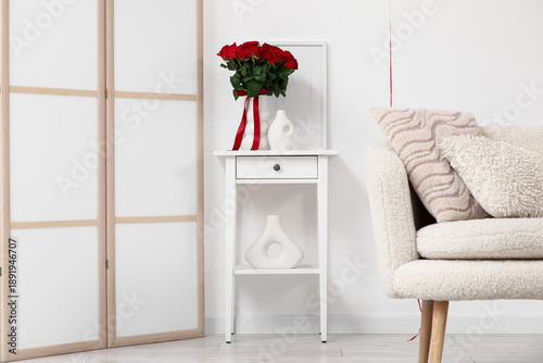 Vase with red rose flowers ...