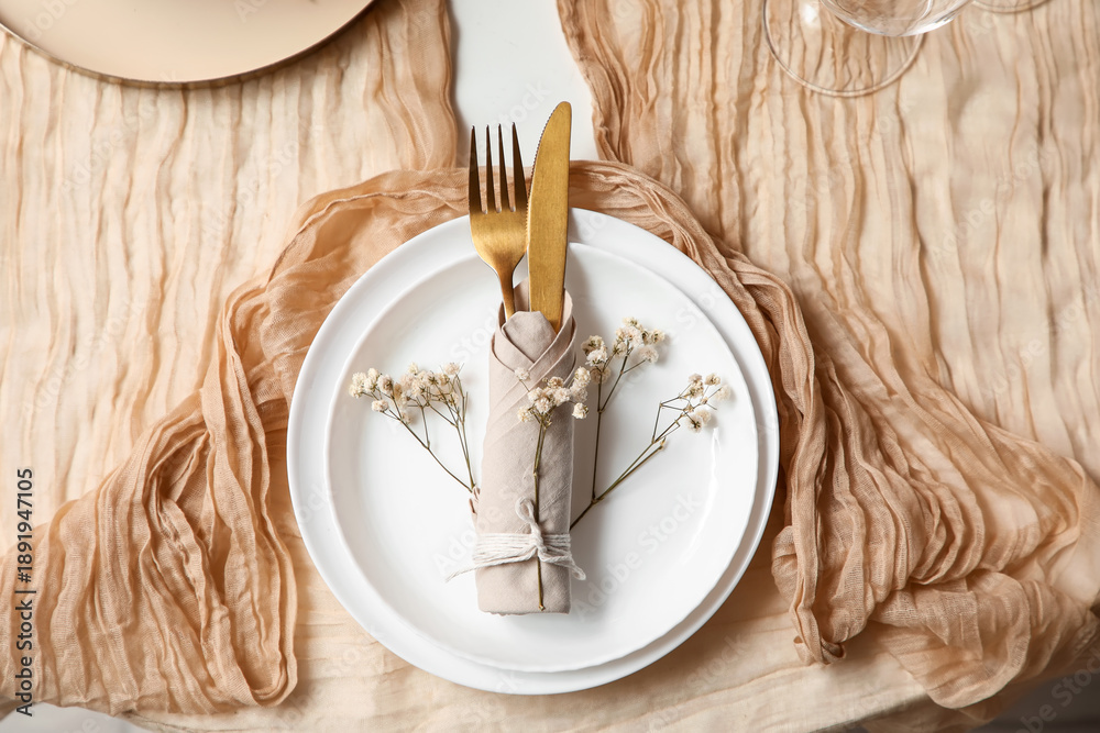 Fototapeta premium Beautiful table setting with gypsophila flowers in living room, closeup
