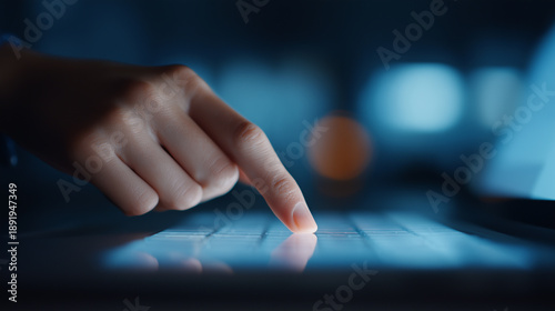 Close up hand on computer laptop keyboard typing digital data. Secure internet technology for cyber security and business innovation in dark room.